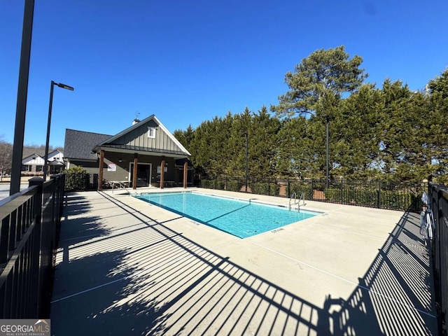 view of swimming pool with a patio area