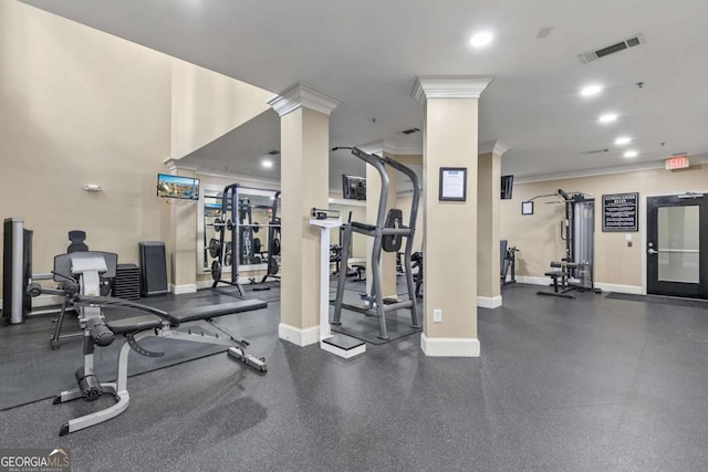 workout area featuring decorative columns