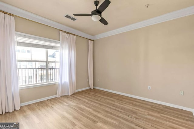 spare room featuring ceiling fan, light hardwood / wood-style flooring, and crown molding