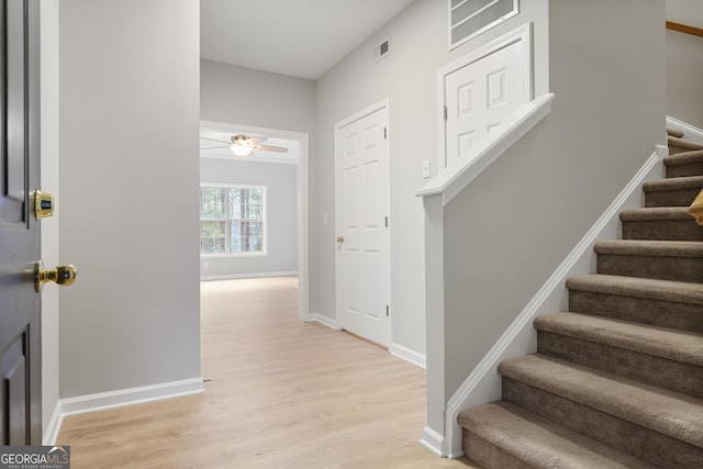 interior space with ceiling fan and light wood-type flooring