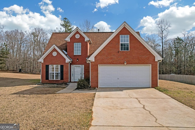 front facade featuring a garage and a front lawn