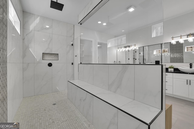 bathroom featuring vanity and a tile shower