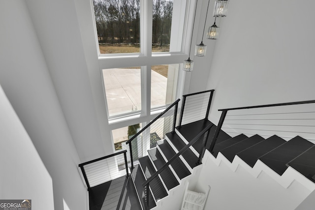 staircase with a wealth of natural light