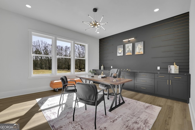 dining room with a chandelier and light hardwood / wood-style floors