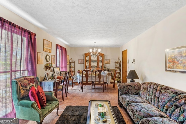 carpeted living room featuring a textured ceiling and a chandelier