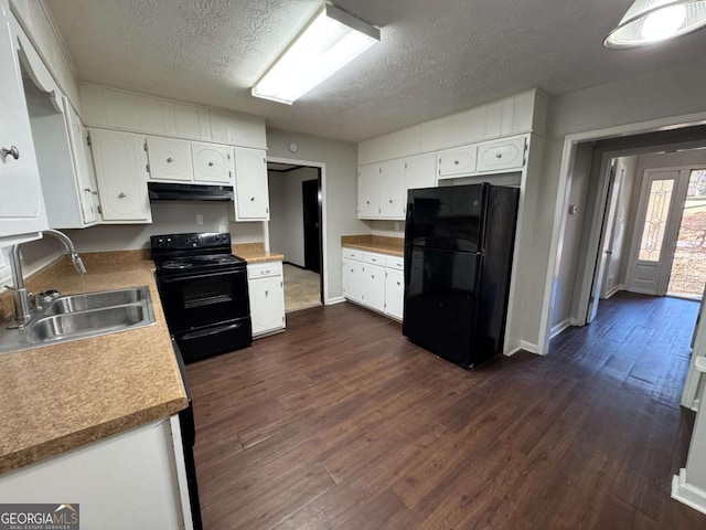 kitchen featuring a textured ceiling, sink, white cabinets, and black appliances