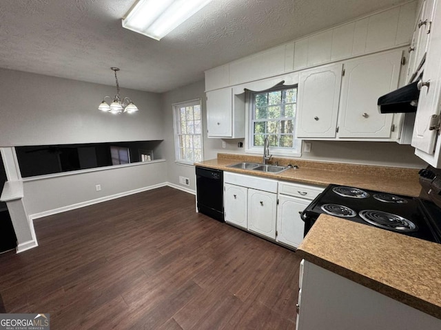 kitchen featuring black appliances, sink, white cabinetry, and pendant lighting