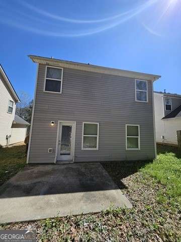 rear view of property with a patio