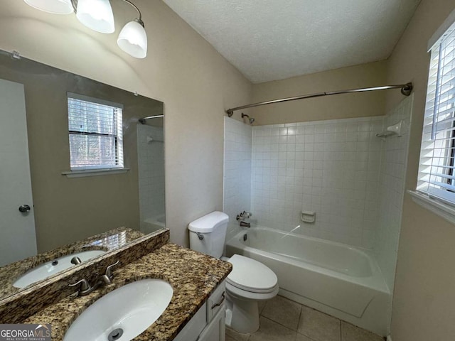 full bathroom with plenty of natural light, a textured ceiling, tile patterned floors, and toilet