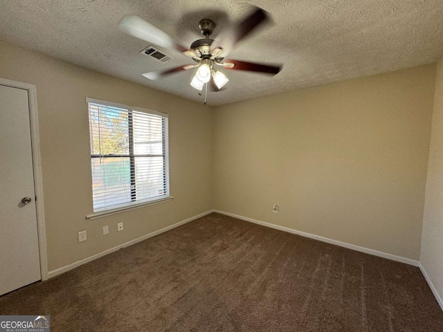 carpeted empty room featuring a textured ceiling and ceiling fan