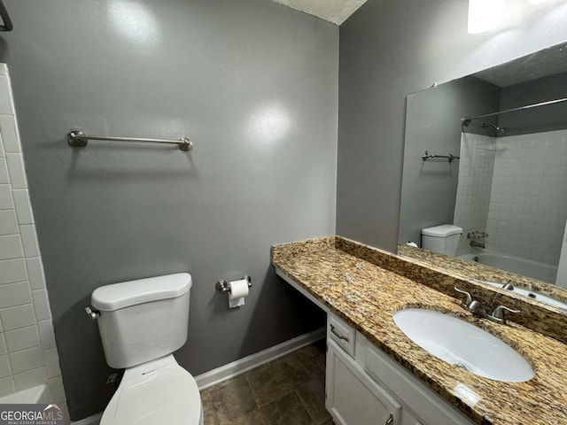 full bathroom featuring toilet, vanity, and bathtub / shower combination