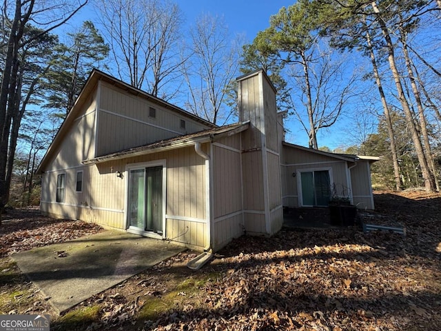 back of property with a patio area