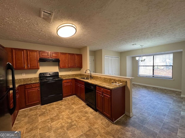 kitchen with pendant lighting, black appliances, sink, kitchen peninsula, and stone counters