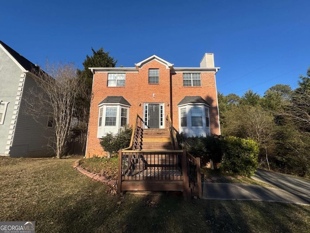 view of front facade with a front lawn