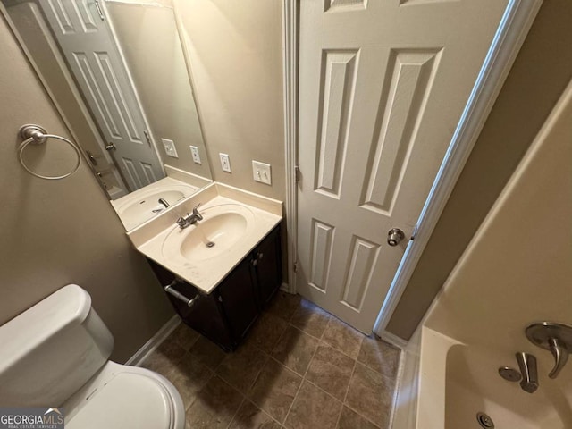 bathroom featuring toilet and vanity