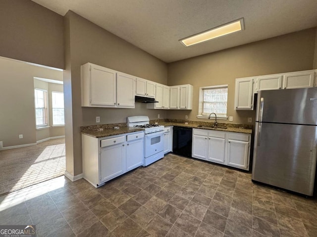 kitchen featuring dishwasher, white cabinets, stainless steel fridge, and white range with gas cooktop