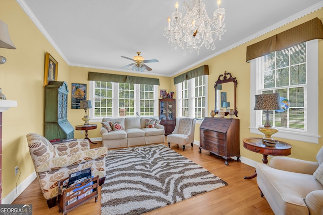 living room with ceiling fan with notable chandelier, crown molding, and wood-type flooring