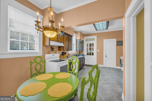 dining room with ornamental molding and a notable chandelier