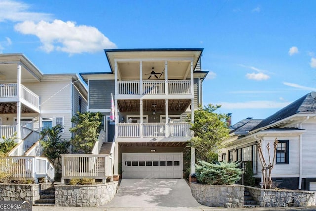 view of front of house with ceiling fan and a garage