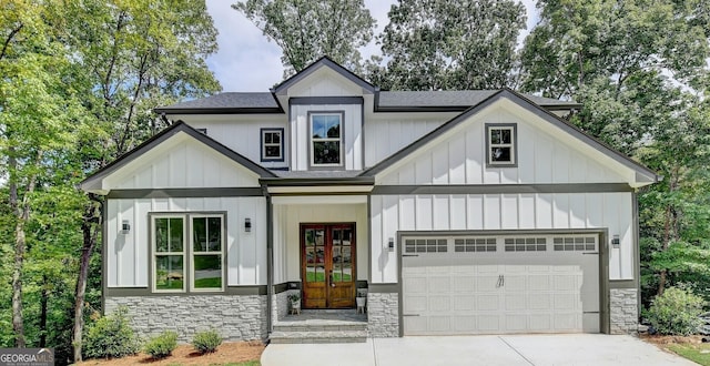 view of front of property with french doors and a garage