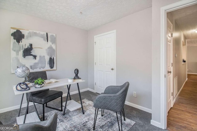 office area with a textured ceiling