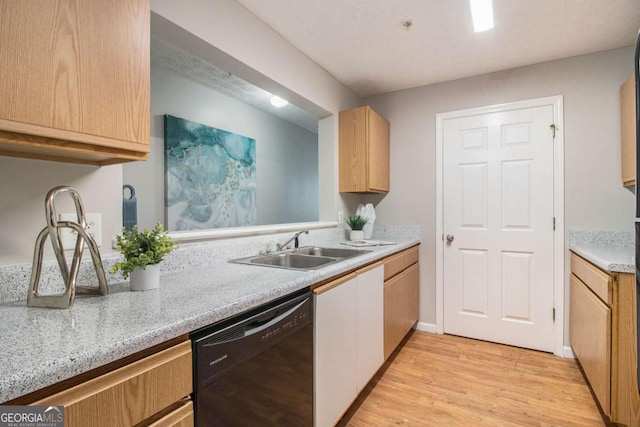 kitchen with sink, dishwasher, and light wood-type flooring