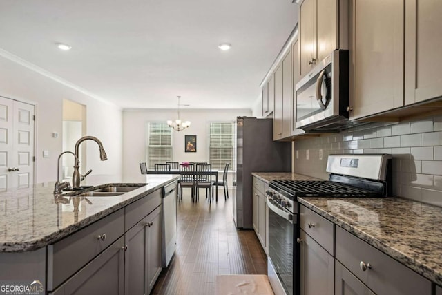 kitchen with sink, appliances with stainless steel finishes, and gray cabinetry