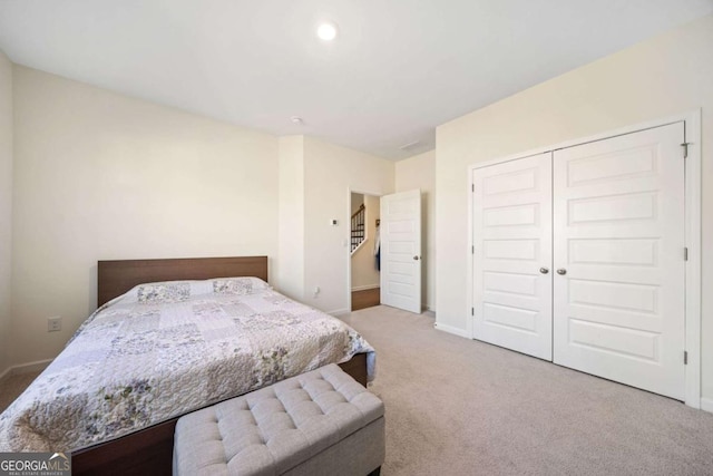 bedroom with carpet and a closet