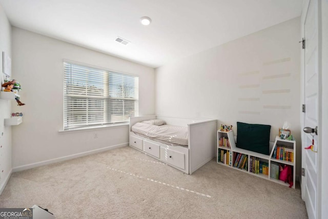 bedroom with light carpet