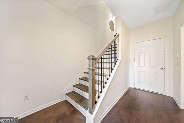 stairway with wood-type flooring