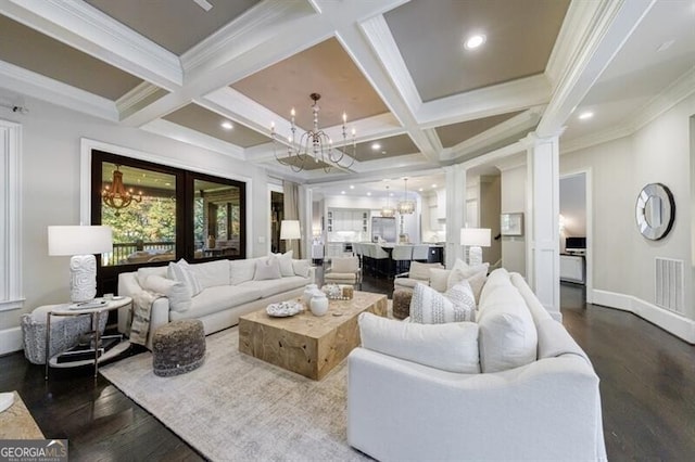 living room featuring coffered ceiling, decorative columns, a notable chandelier, dark wood-type flooring, and beamed ceiling