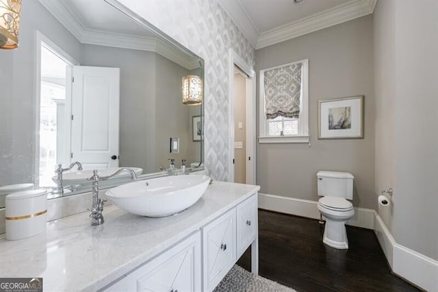 bathroom featuring crown molding, a healthy amount of sunlight, and hardwood / wood-style floors