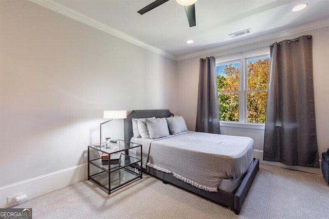 bedroom featuring ceiling fan, crown molding, and carpet flooring