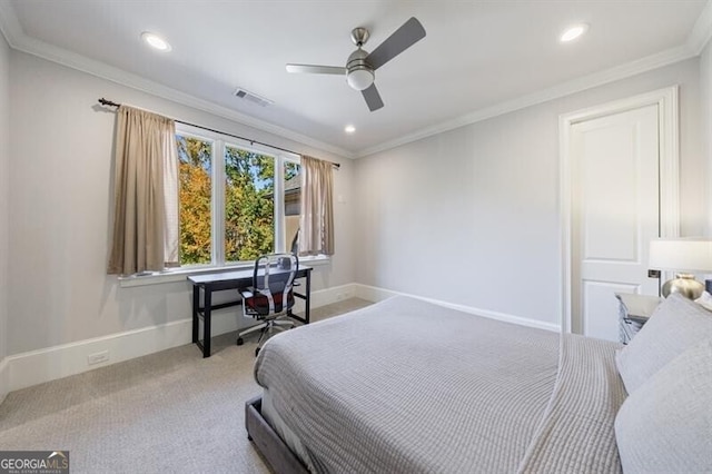 carpeted bedroom with ceiling fan and ornamental molding