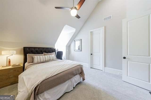 bedroom with ceiling fan, light colored carpet, and lofted ceiling