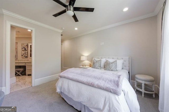 carpeted bedroom with ensuite bathroom, ceiling fan, and ornamental molding