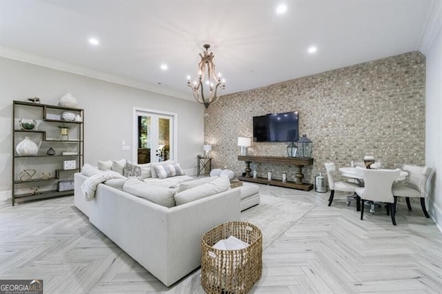 living room featuring french doors, ornamental molding, a chandelier, and light parquet flooring