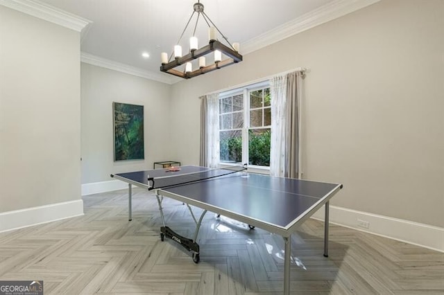 game room featuring a notable chandelier, crown molding, and light parquet floors