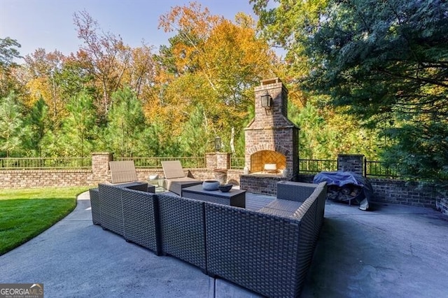 view of patio / terrace featuring an outdoor living space with a fireplace