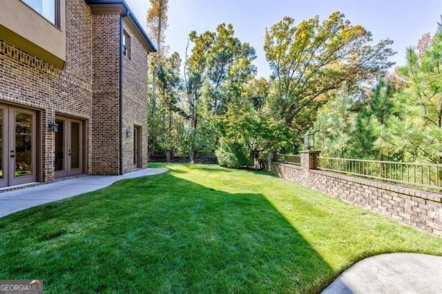 view of yard featuring french doors