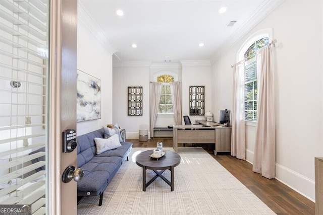 home office featuring hardwood / wood-style floors and crown molding