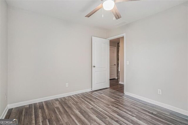 unfurnished room featuring ceiling fan and wood-type flooring