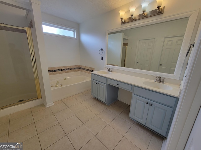 bathroom with separate shower and tub, vanity, tile patterned flooring, and a textured ceiling