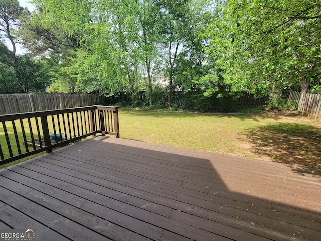 wooden deck with a yard