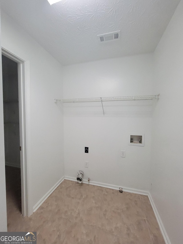 laundry room with hookup for a washing machine, gas dryer hookup, and electric dryer hookup