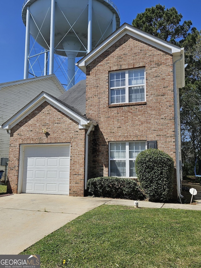 front facade featuring a garage and a front lawn