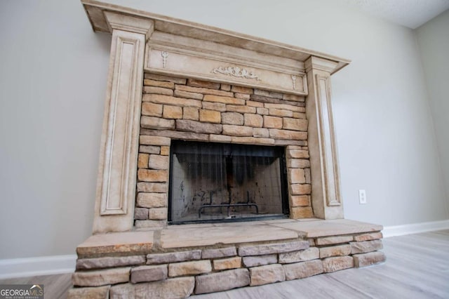 details featuring a fireplace and hardwood / wood-style flooring