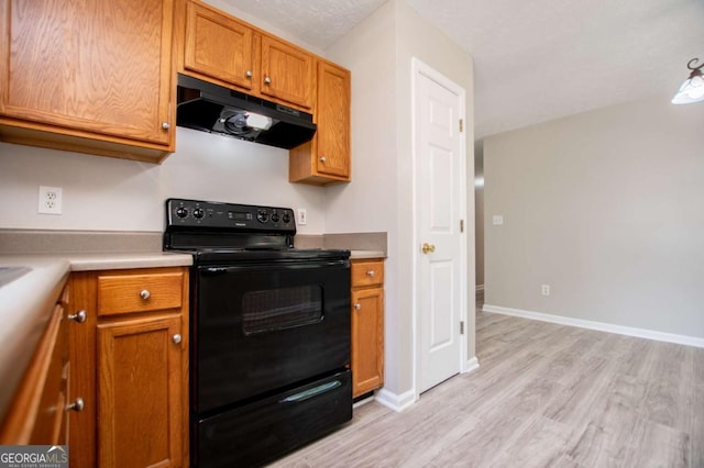 kitchen with black electric range oven and light hardwood / wood-style flooring