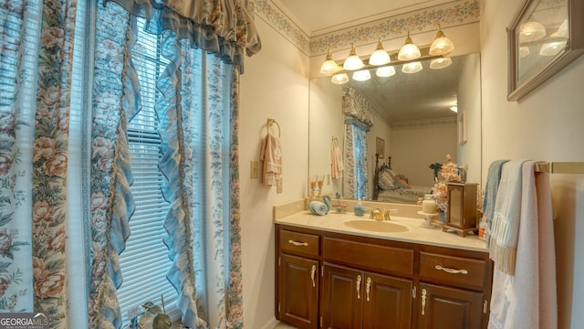 bathroom featuring vanity and ornamental molding