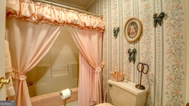 bathroom featuring toilet and shower / tub combo with curtain